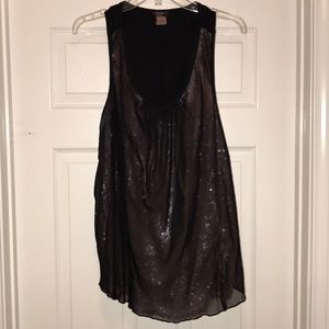 Sleeveless black sheer over pink sequins.